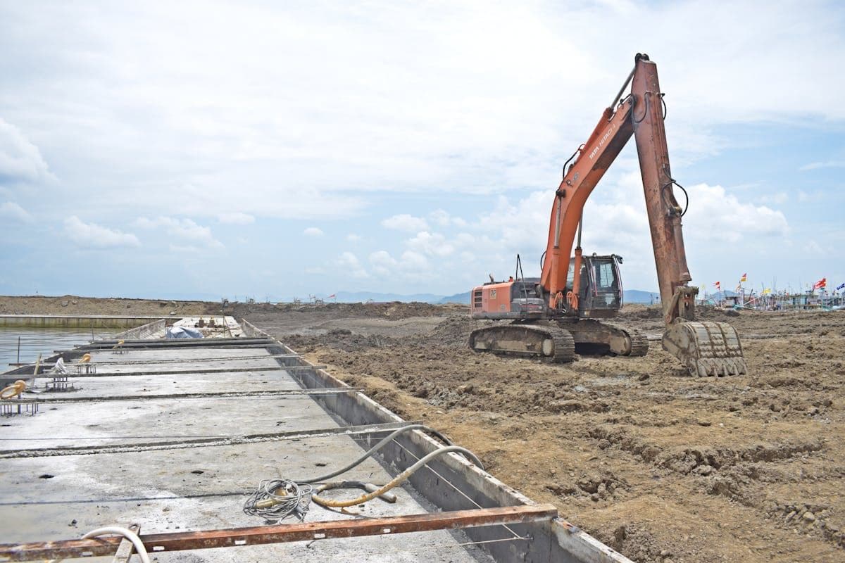 Excavator levelling a large residential site