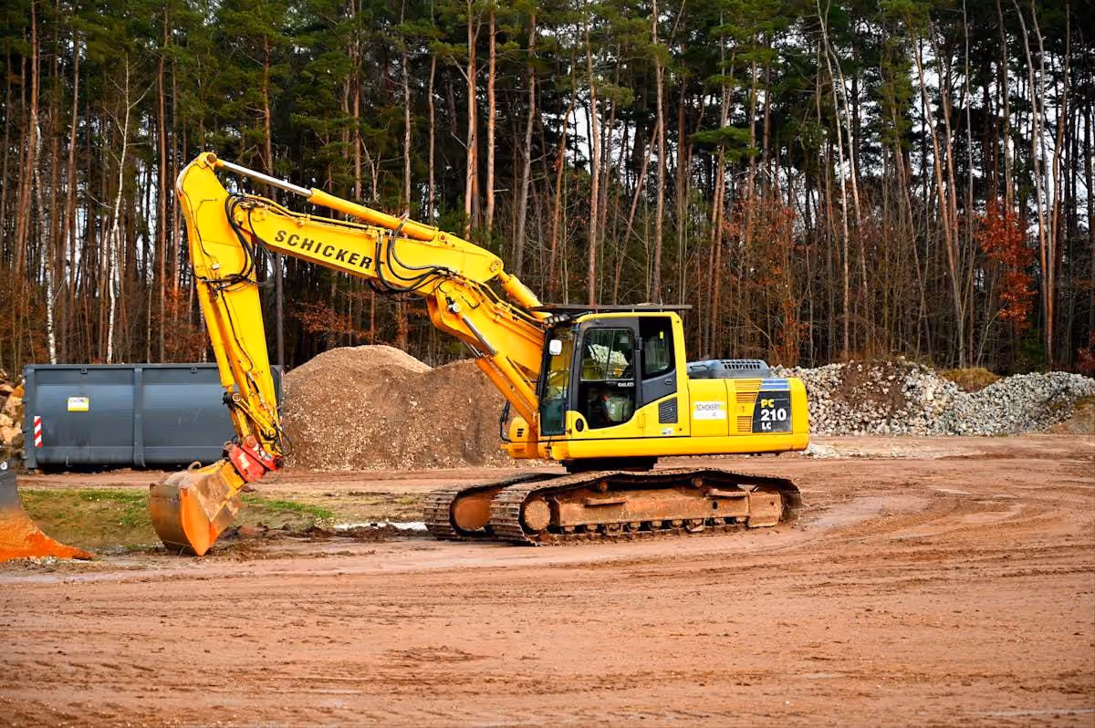Excavator performing site earthworks and land clearing