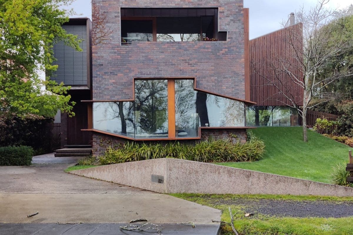 Custom home set against bushland with stone and timber facade
