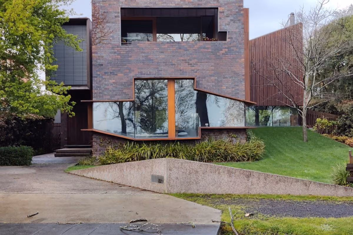 Custom home set against bushland with stone and timber facade