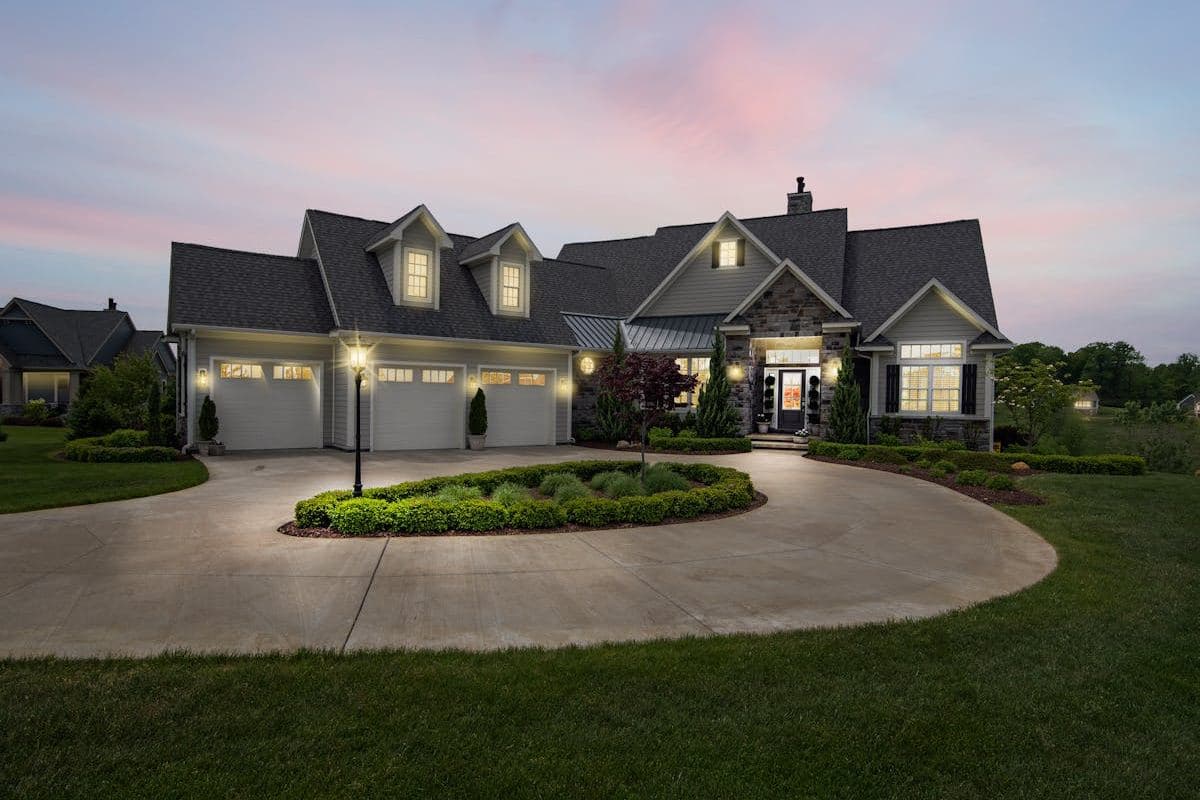Split-level custom home on a sloping block with cantilevered upper floor