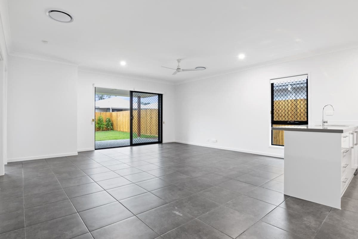 Granny flat with timber deck and louvred screening