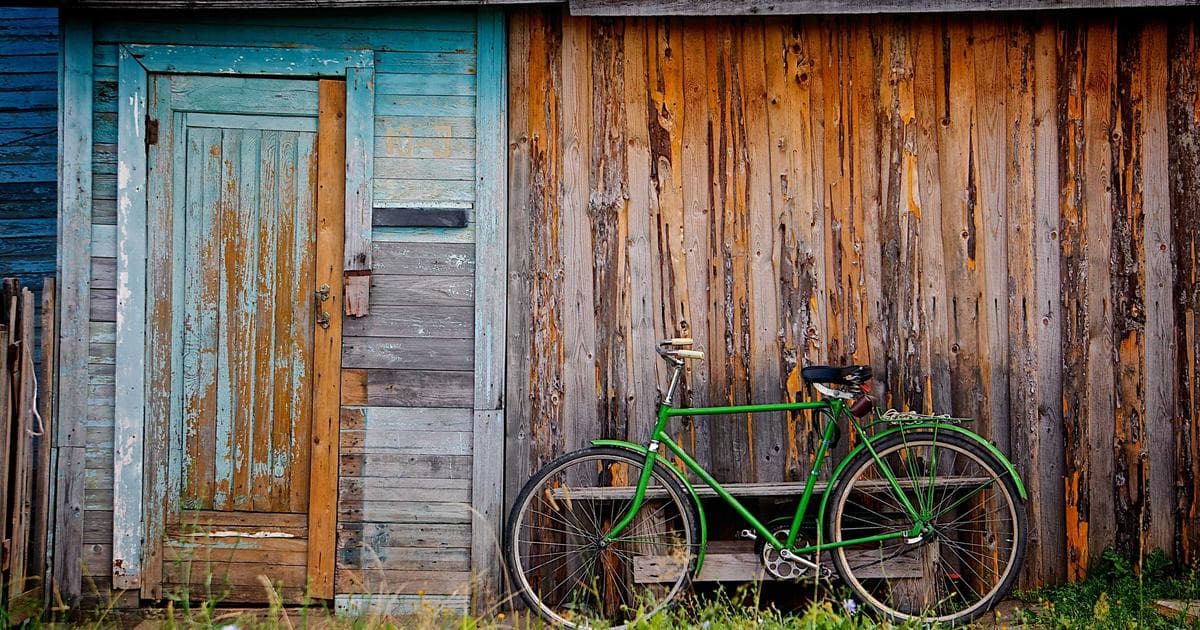 Weathered timber boards and an old door with peeling paint