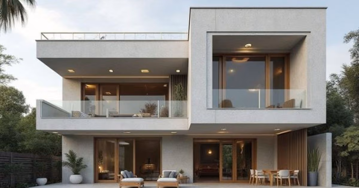 Modern concrete and render two-level home with a large upper balcony and glass sliding doors