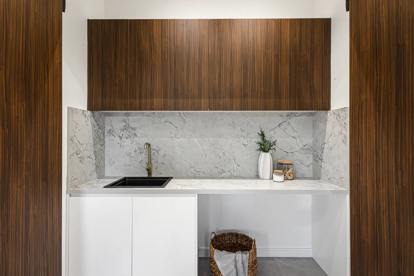 Walnut cabinetry and a marble splashback in the Fairfield Heights project